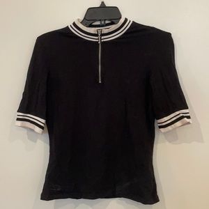 Black T-shirt with white trim and front zip